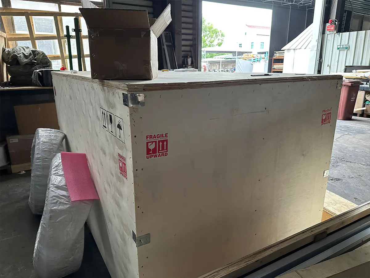 Dumbwaiter modernization: wooden crate packaging protecting new retrofit components
